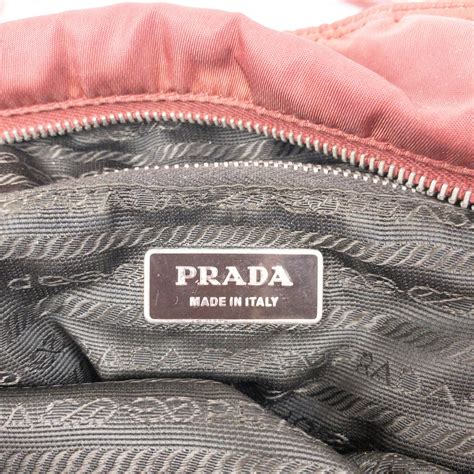 prada maroon handbag.